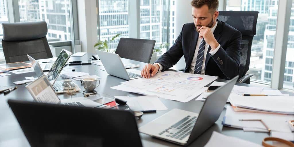 Professional consultant reviewing implementation plans with client.