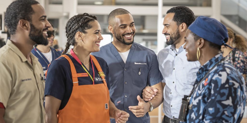 Smiling diverse workers collaborating