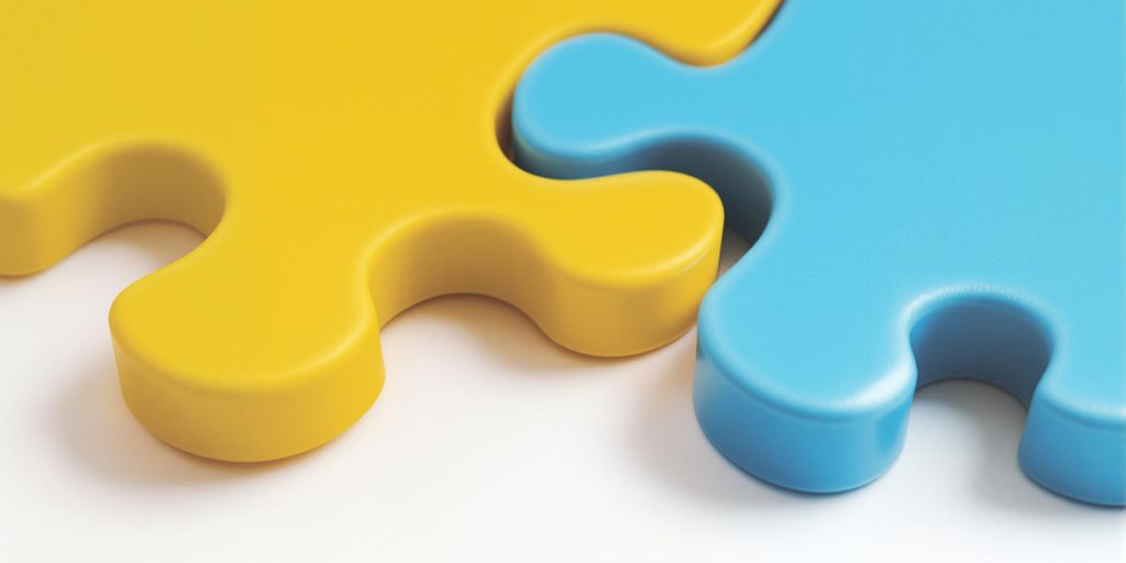 Two puzzle pieces fitting together perfectly