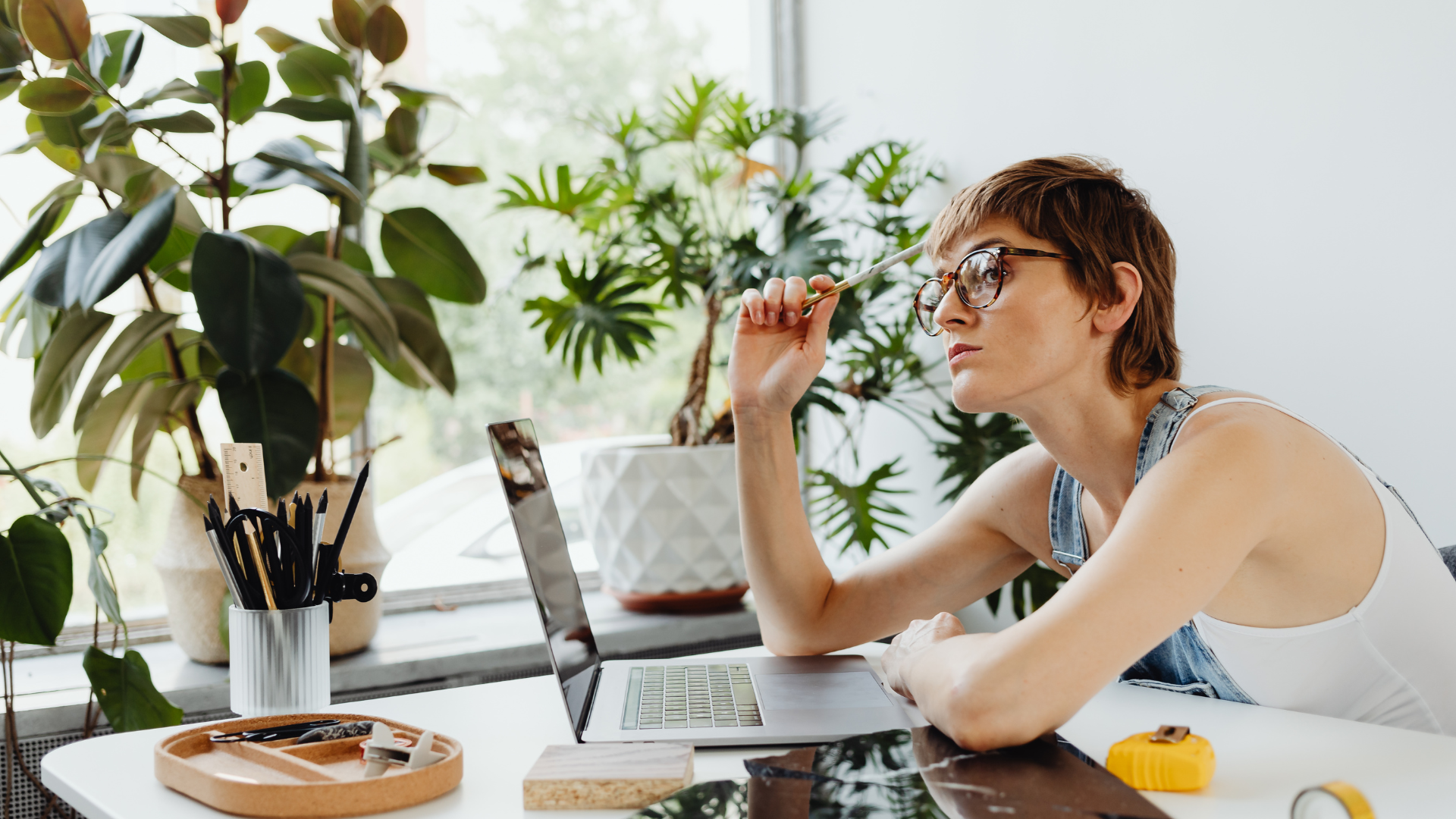 Thinking infront of the laptop for the ultimate free cover letter